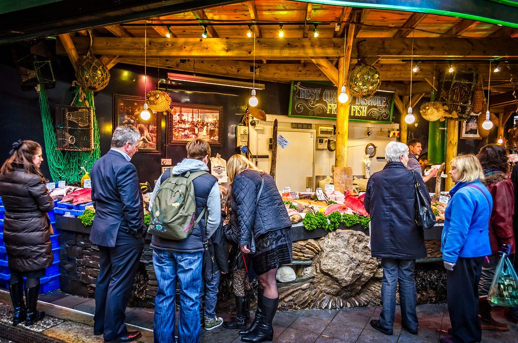 Shoppers queueing at a busy fishmonger stall